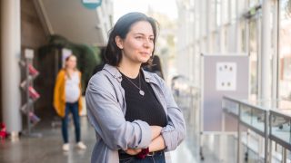 A woman looking optimistically and a determinant look on her face to the future