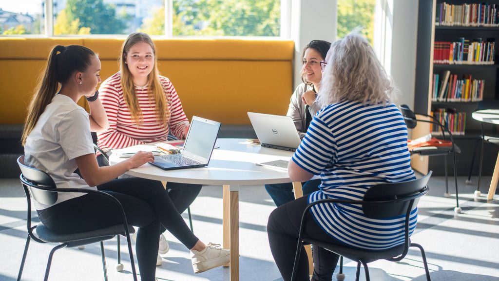 Four people studying together